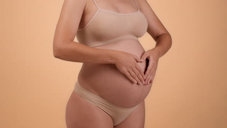 pregnant woman with hands on belly