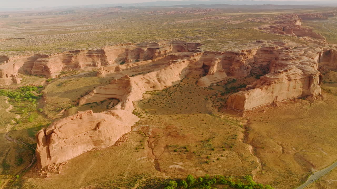 Amazing rock formations from air erosion in huge desert. Arches National park in Utah, USA from aerial perspective on sunny day.