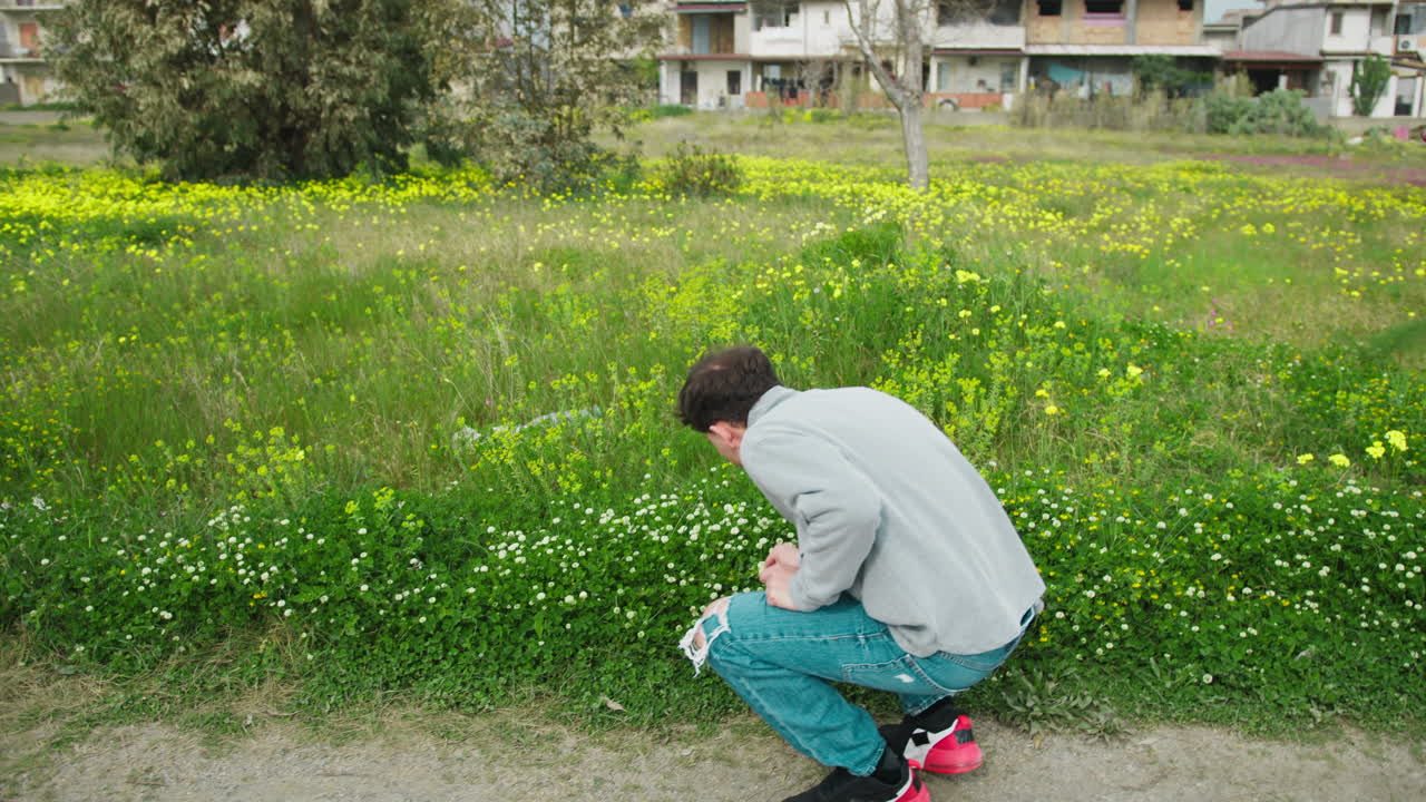 Relaxing Walk For A Man In The Nature In Search Of Flowers