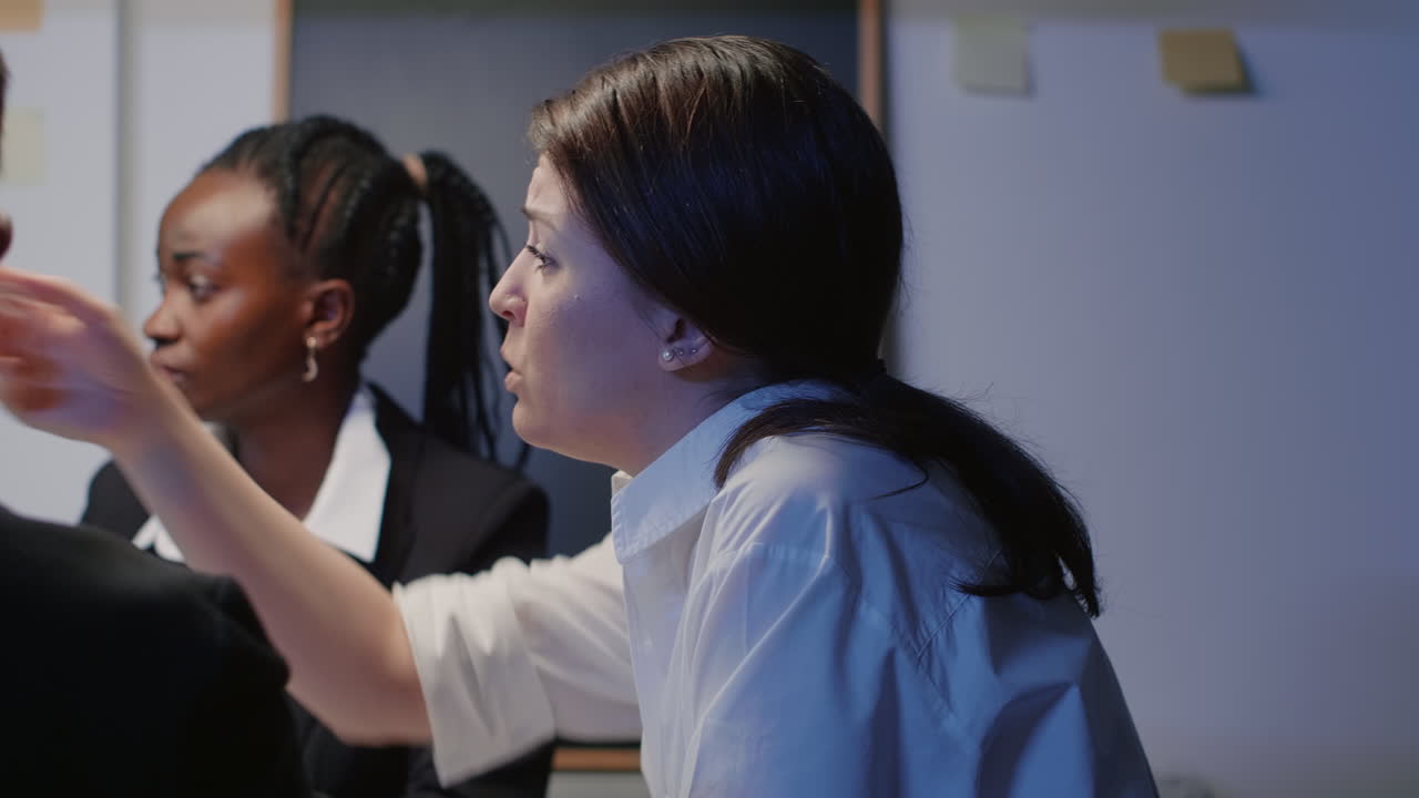 Entrepreneur woman discussing financial graphs using presentation monitor