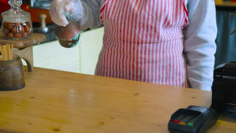 restaurant employee cleaning counter