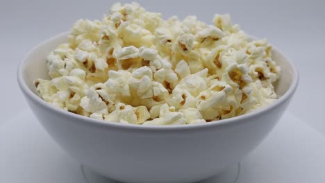 a bowl of popcorn isolated on white background