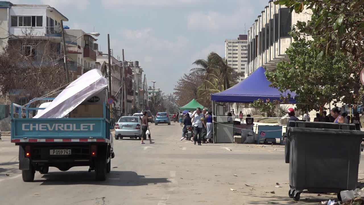 People of Havana queuing for fresh water and food in Havana