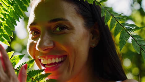 smiling woman with fern leaves