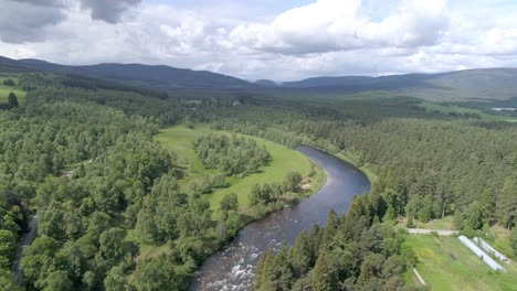 aerial push in over the river dee, countryside and trees in aberdeenshire