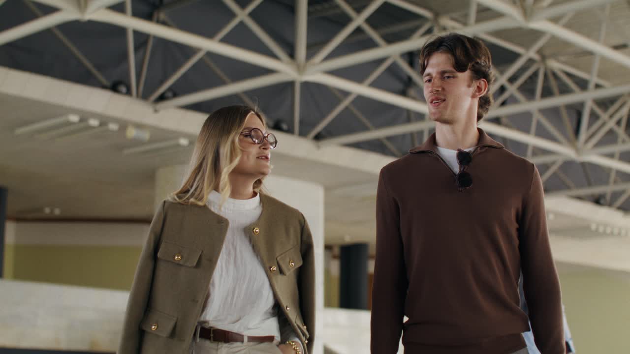 Couple Walking in a Modern Building