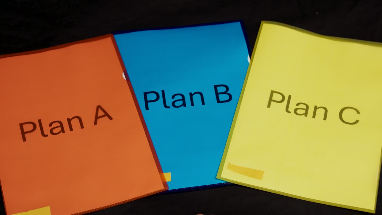 A hand points to three colorful folders labeled Plan A, Plan B, and Plan C, symbolizing the process of decision-making, evaluation, and strategic choice