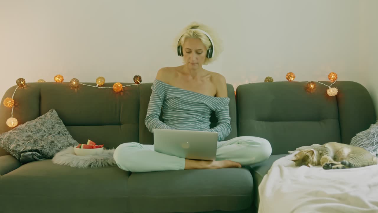 Woman working from home on a couch