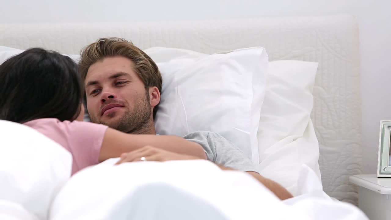 Couple cuddling and chatting