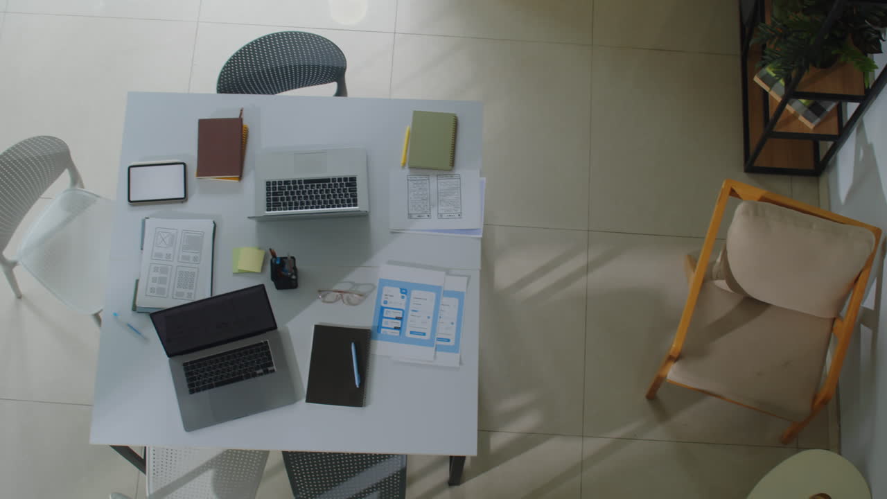 Workplace of IT Specialists with Laptops Top Down