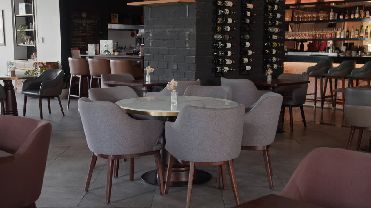 Modern Restaurant with Elegant Wine Display and Comfortable Seating