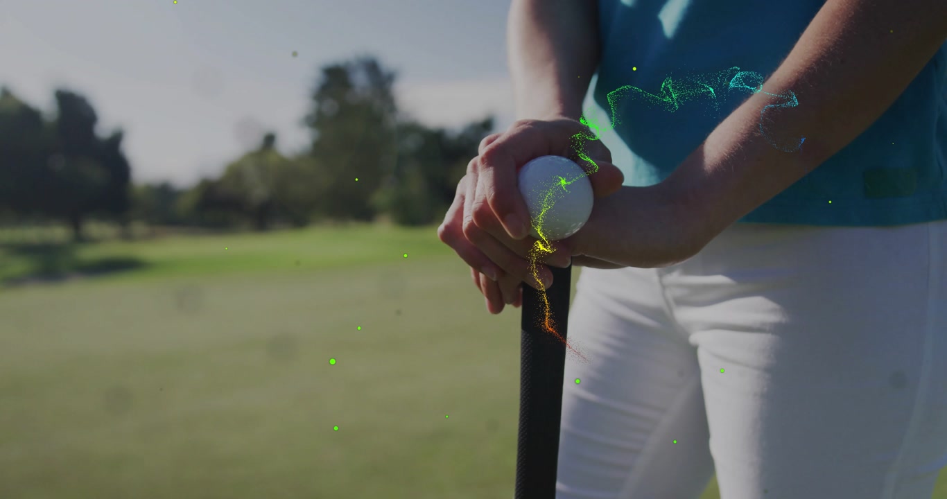 woman lining up putt initiating light trails swirling around ball and putter for sports technology