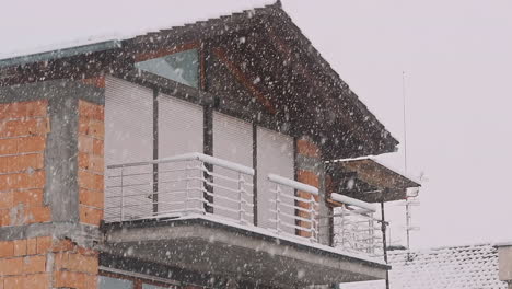 buildingunder the snow during snow blizzard