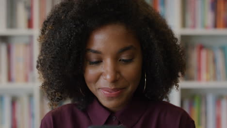 portrait-young-happy-african-american-girl-using-smartphone-enjoying-browsing-online-texting-sending-sms-messages-smiling-black-woman-in-library-bookstore