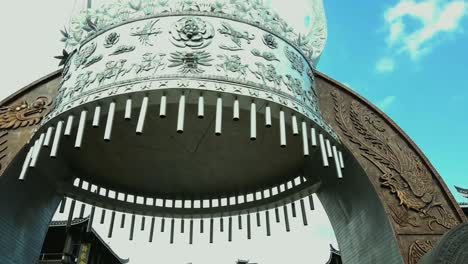 miao minority symbol construction. pan left, low angle