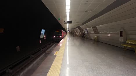 underground train stops at a platform and passengers embark and disembark 1