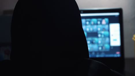 Slow-Motion---Head-a-woman-wear-veil-doing-group-zoom-meeting-with-hand-on-the-laptop-keyboard