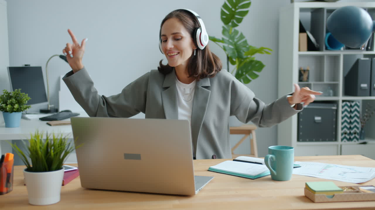 Woman Dancing While Working From Home
