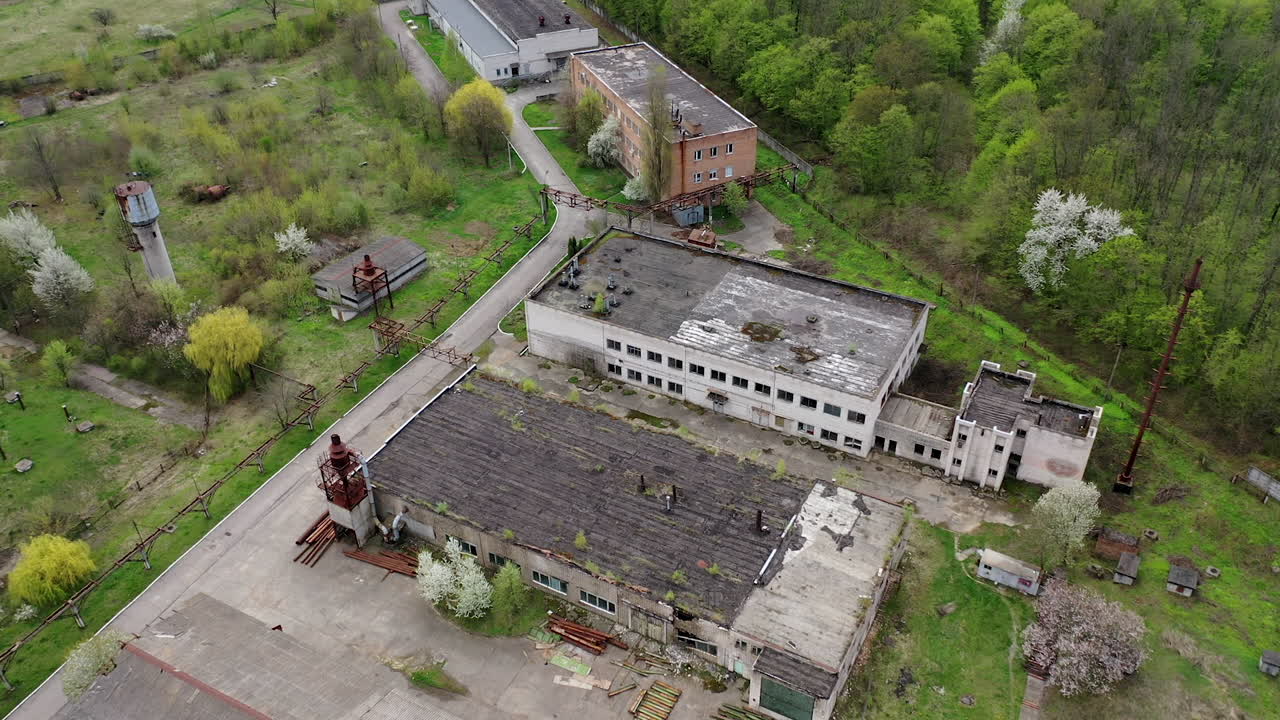 Apocalypsis aero view city. Aerial shot of crashed ruined factory in the city.