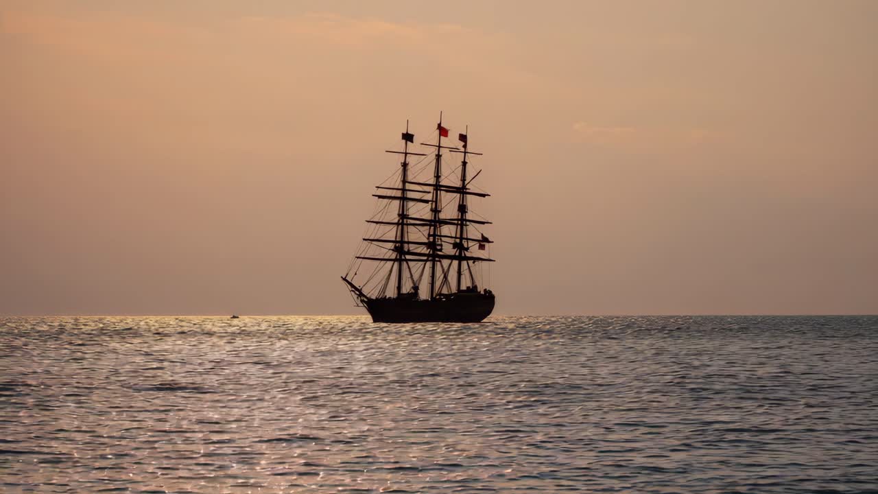 Tall Ship Sailing at Sunset