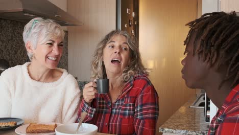 people having breakfast in the kitchen