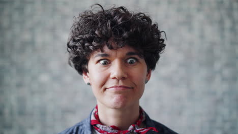 woman with curly hair and funny expression