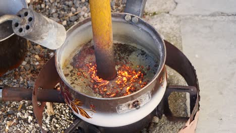 Metal-bar-perpendicular-melting-with-torch-fire