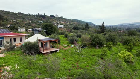 drone shot of a yurt tent bed and breakfast in the ecological community settlement klil