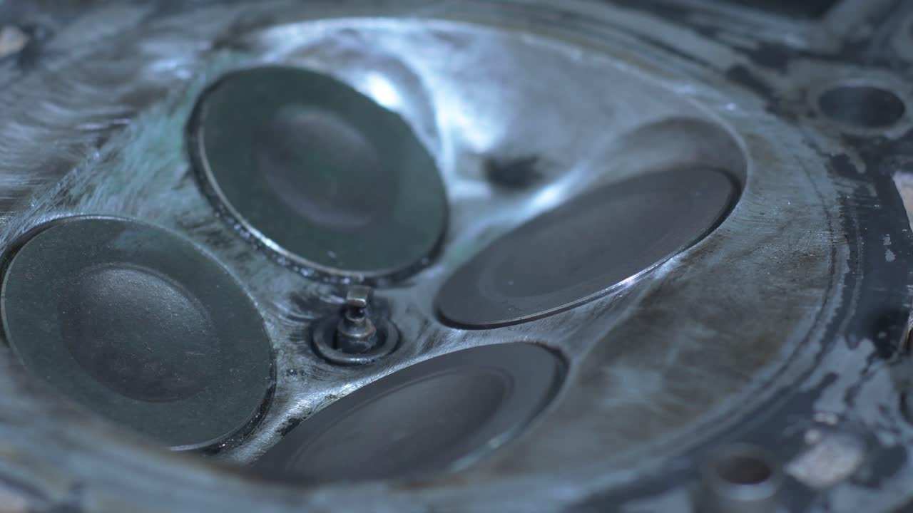 Extreme close-up view of the clean cylinder head and valve mechanism, highlighting the technical precision of engine maintenance