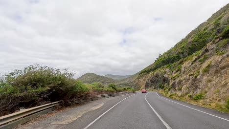 a 13-second video captures a drive along the picturesque great ocean road, showcasing coastal views and lush greenery under cloudy skies