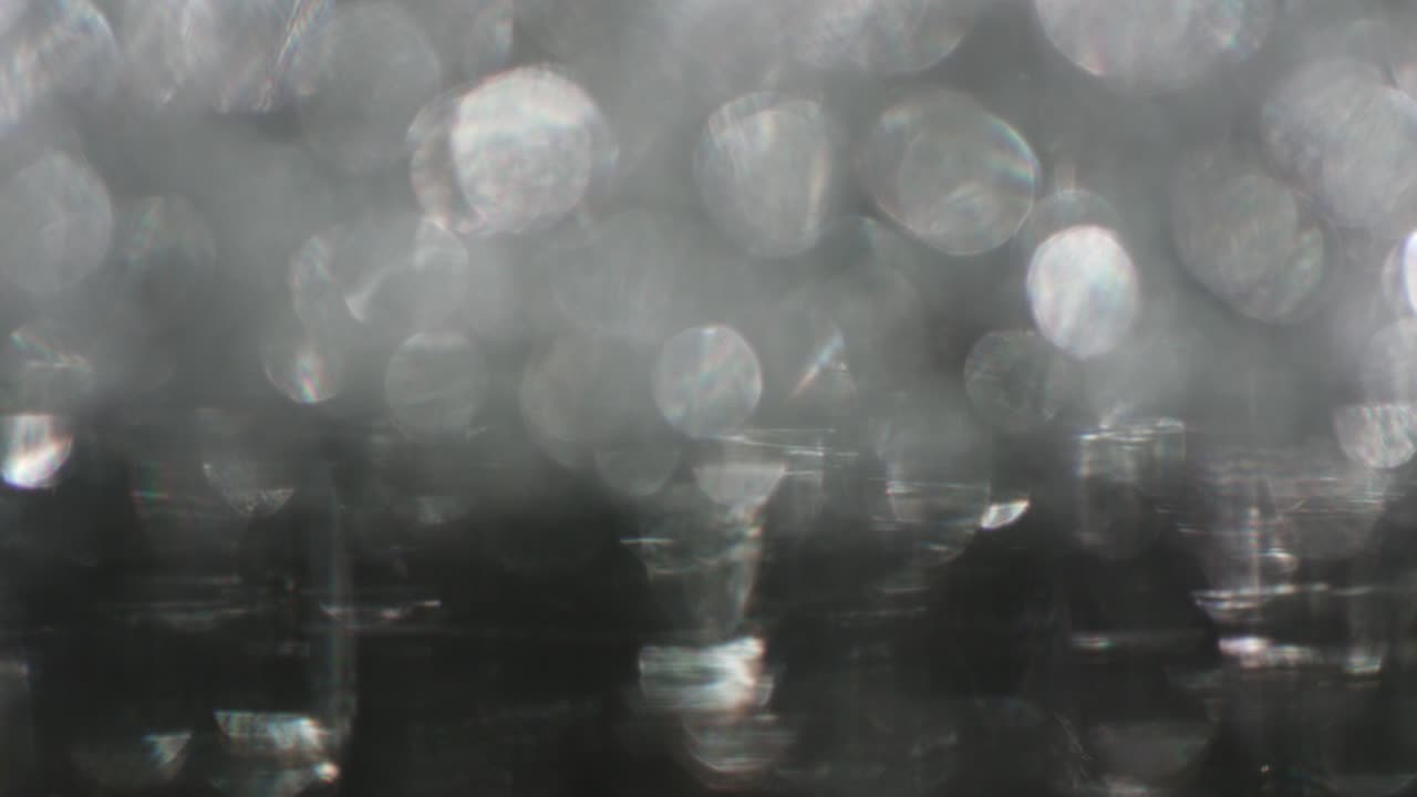 la rotación de los círculos bokeh en el sentido de las agujas del reloj