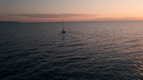 Sailing-Boat-In-The-Gulf-Of-Saint-Lawrence-With-A-Stunning-Landscape-Of-Sky-Reflecting-On-The-Water-Surface-In-Quebec,-Canada