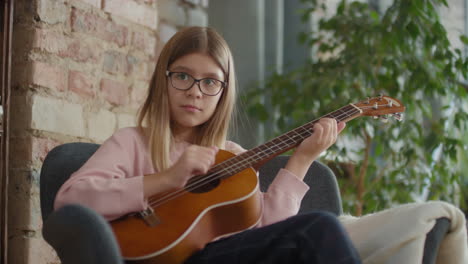 girl playing ukulele