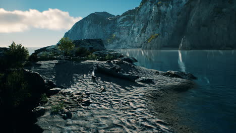 beach-coast-of-the-Norwegian-Sea-with-mountains-and-cliffs-on-sunny-day