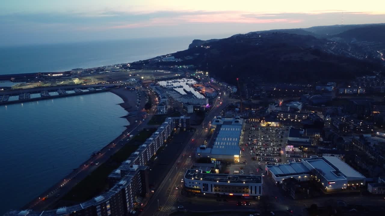 Aerial view of a coastal city at night