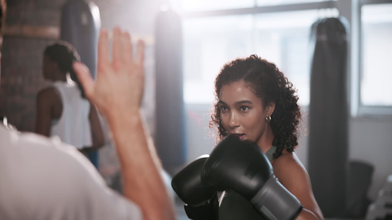 A woman training with a boxer