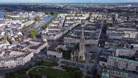 Aerial-panoramic-view-of-Caen,-circling-Saint-Pierre-church,-France