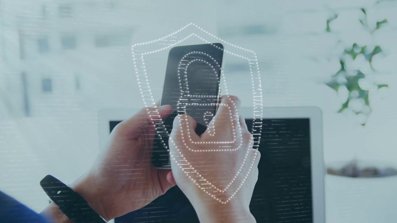 IT professional hands tapping smartphone above laptop, fingerprint shield animation securing login