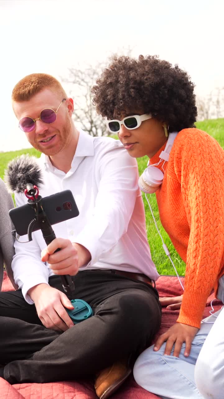 People Vlogging During a Picnic