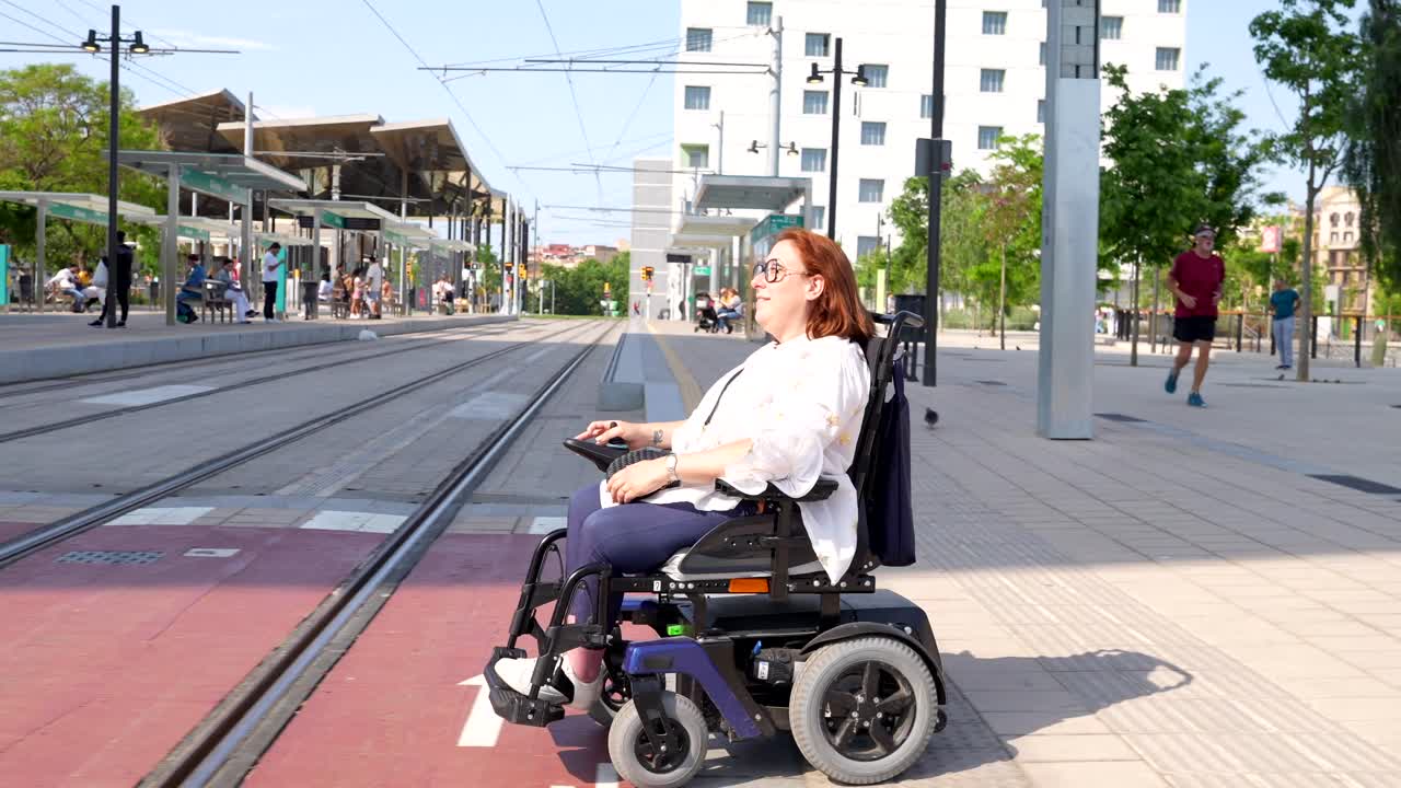 Woman in Wheelchair on Tram Tracks