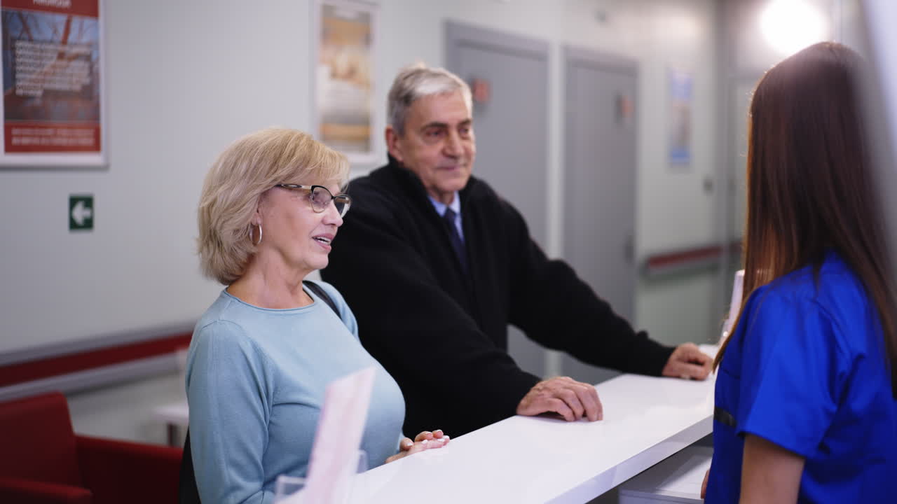 Patients at a clinic reception desk