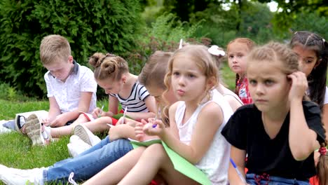 group of cheerful children learning outdoors at school after quarantine lockdown