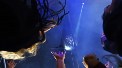 group of people dancing at a concert 4k