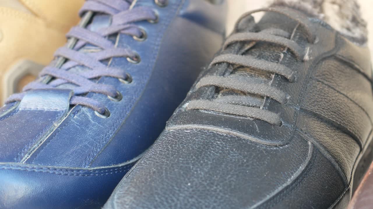 Close-up of blue and black sneakers