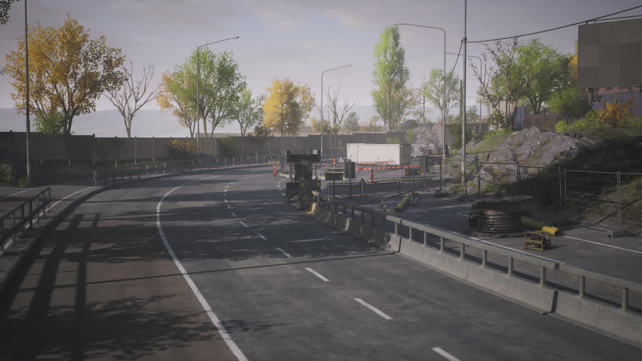 Urban road under construction with trees in autumn foliage