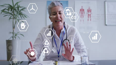 animation of eco icons and data processing over caucasian female doctor
