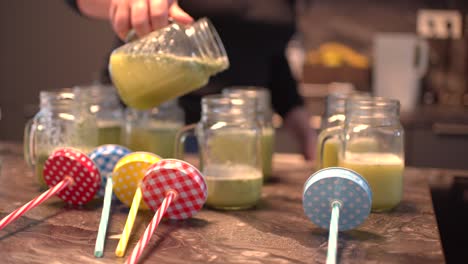 young latin girl prepare cocktail mocktail or smoothie at her kitchen