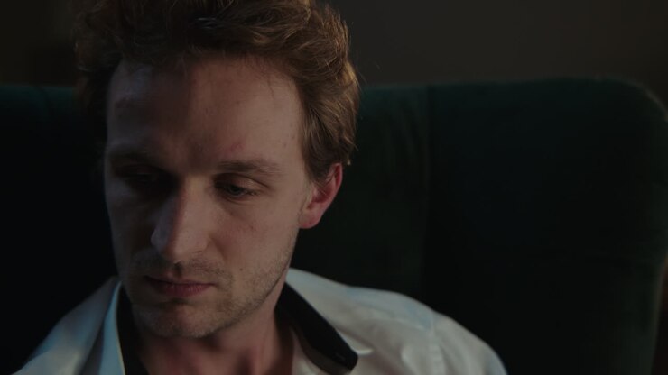 Close-up of a Man Seated in a Chair