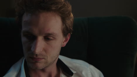 close-up of a man seated in a chair