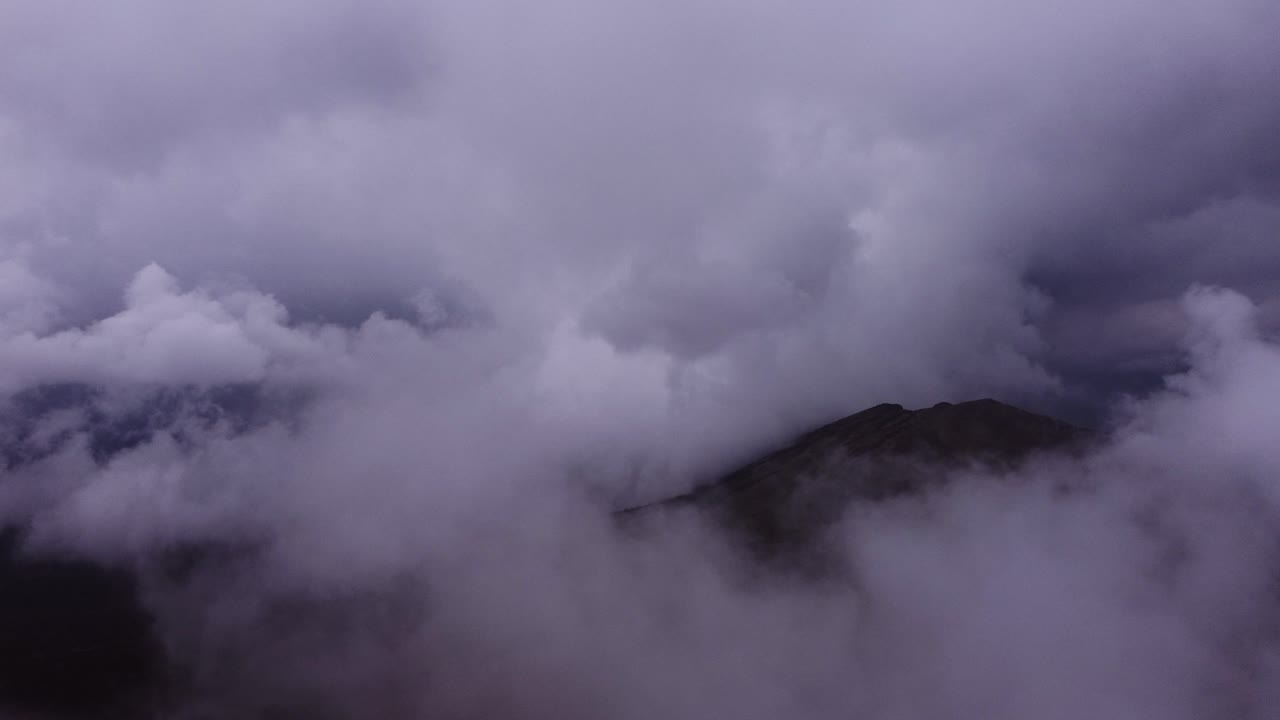 Clouds over the mountains flying with drone